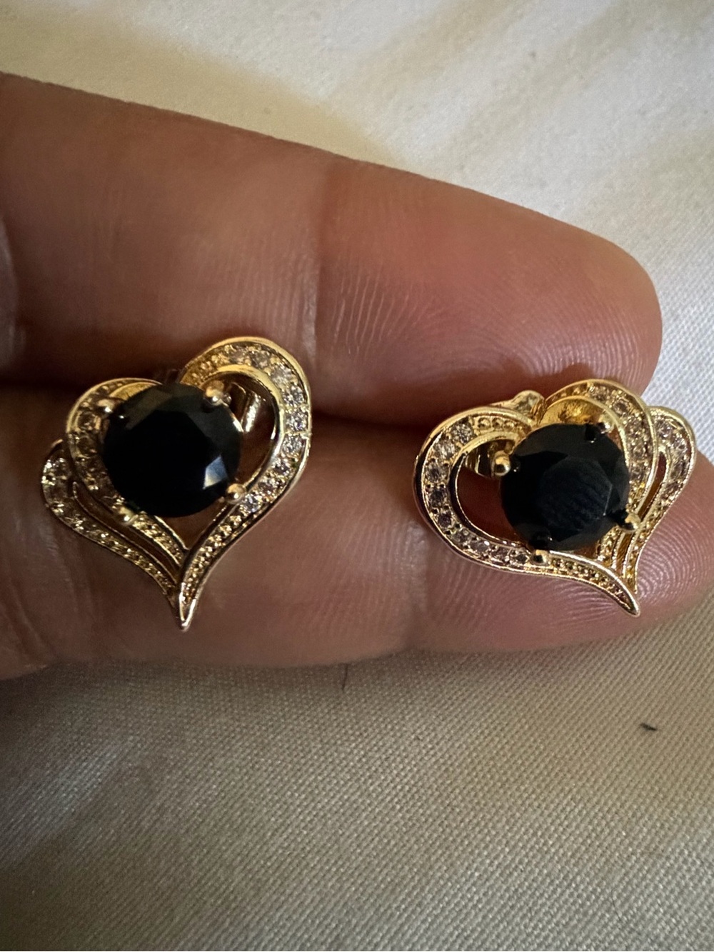 Ping Gold Heart Earrings with Black Stones